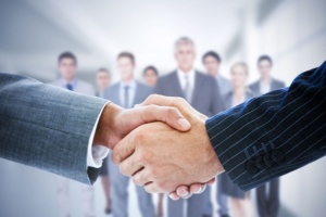 42323560 - composite image of business people shaking hands